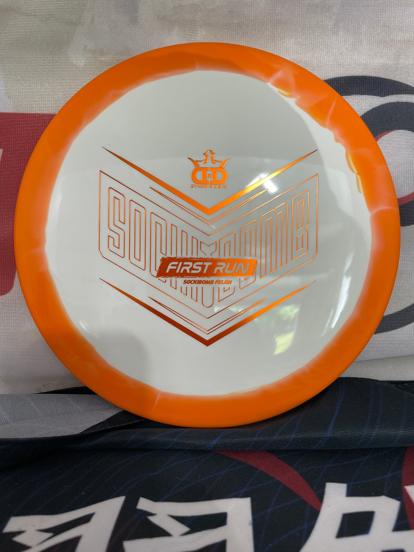 Dynamic Discs Felon Supreme Orbit 175g White-Orange Swirl Sockibomb First Run Distance Driver