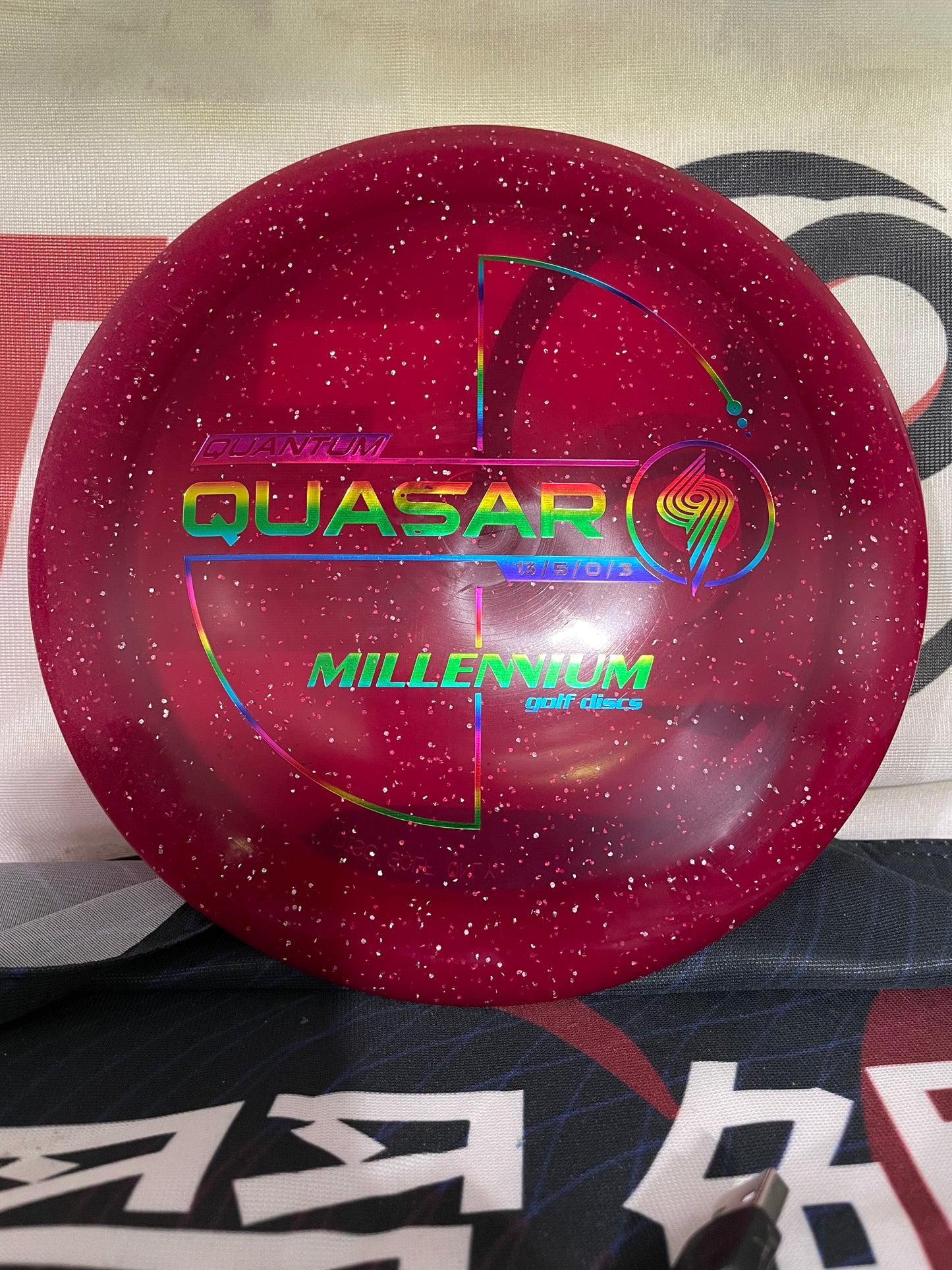 Millennium Quasar Quantum 175g Red w/ Rainbow Foil Distance Driver